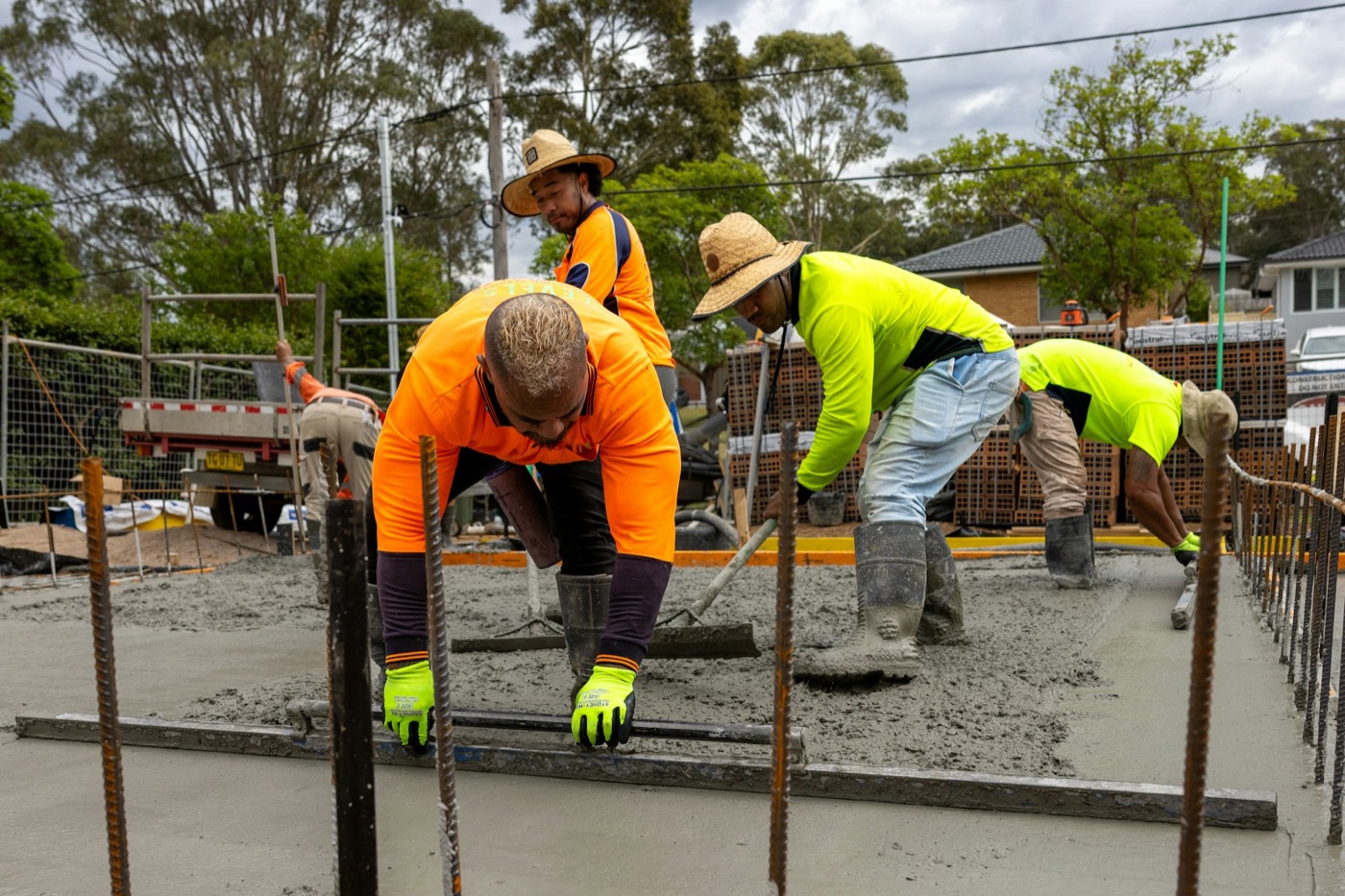 Crew pouring the concrete slab on site